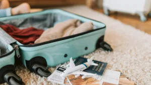 Hajj packing list essentials including suitcase, passport, tickets, and travel items prepared for pilgrimage